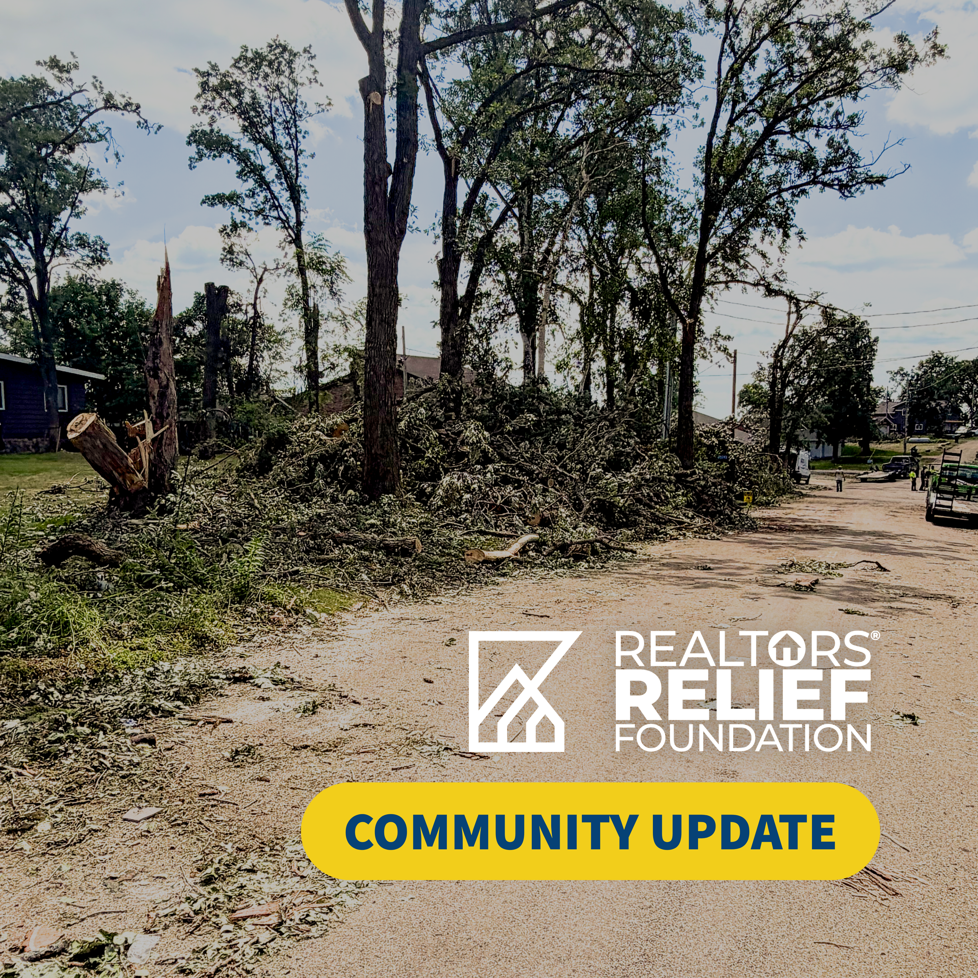 An image of a rural road with broker trees from a tornado. At the bottom of the image, it says 